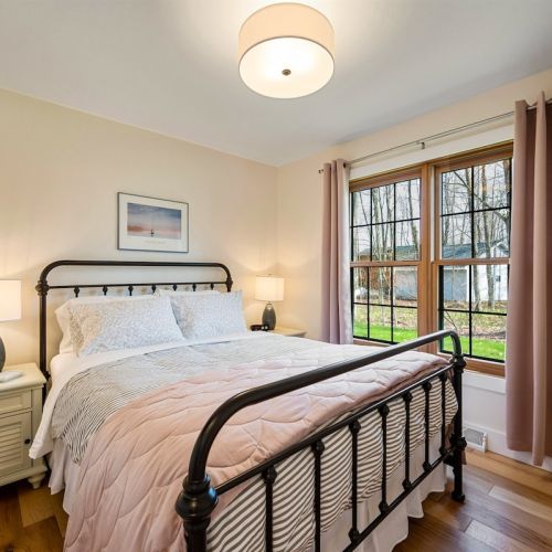 The Queen Bedroom has a smart tv, closet, and room-darkening shades.