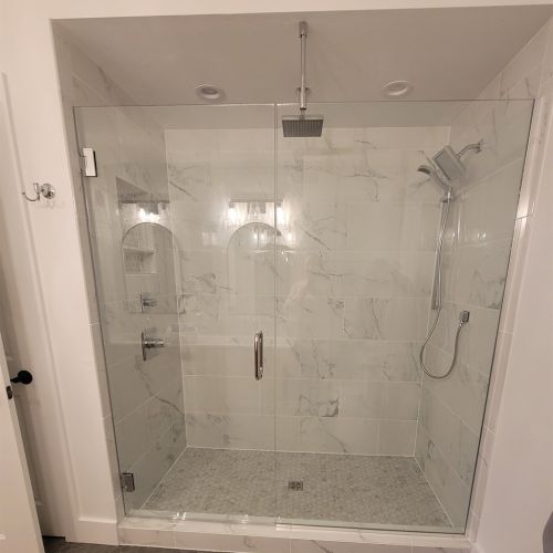 The primary bathroom has a new, luxurious, walk-in tile shower.