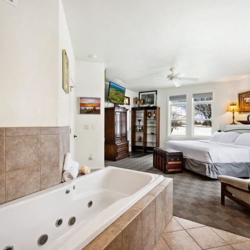 Bedroom #1 boasts a comfortable king sized and large whirlpool tub with en suite bathroom.