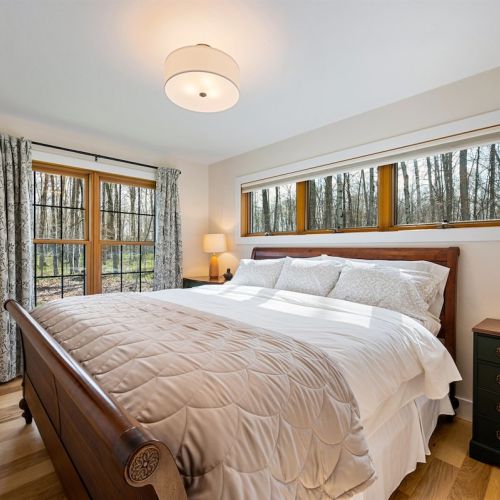 The second bedroom has a king-sized bed, plenty of windows, and a smart tv.  There are room darkening window treatments in all of the bedrooms.