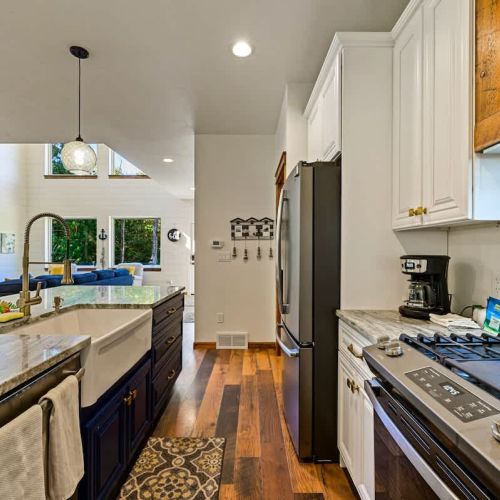 The chef's kitchen is well-appointed with top-of-the-line appliances, offering a gourmet experience for those who love to cook and entertain.