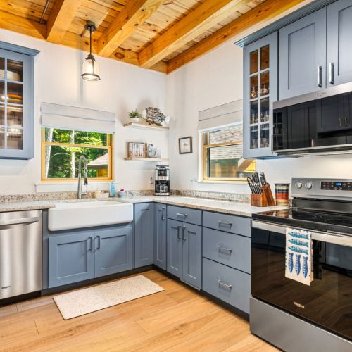 Enjoy connection over a homemade meal in the eat-in kitchen, enjoy a movie on the DVD player, or simply unwind while taking in the peaceful wooded surroundings.