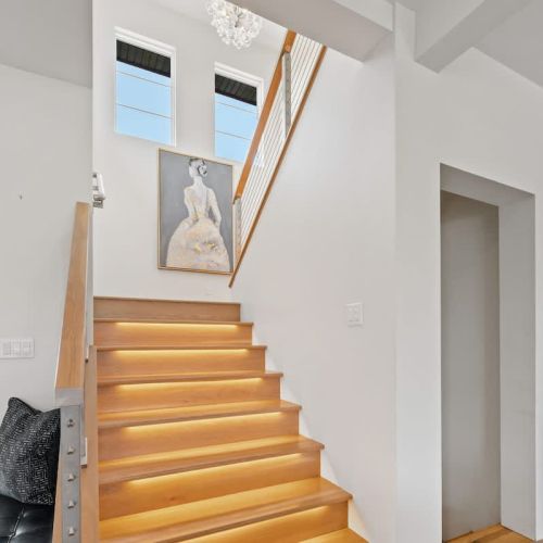 Heading upstairs to the second level, you'll find the main sleeping area with three additional bedrooms.