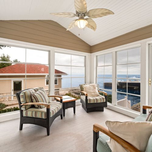 Just off the main living area, there’s a comfortable three-season sun porch, ideal for sipping your morning coffee or curling up with a good book.