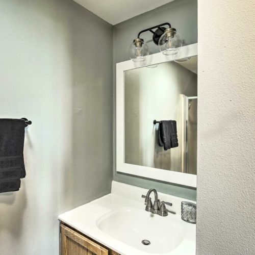 Experience the convenience of two shared bathrooms located in the left wing  of the house.