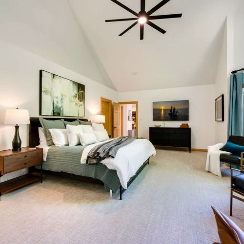 The large king in the primary bedroom with ensuite bath is the best place to unpack and enjoy your vacation in Door County.