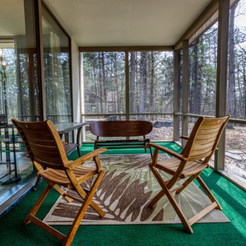Enjoy the three seasons screened-in porch at the front of the home, perfect for enjoying your morning coffee or relaxing with a good book.