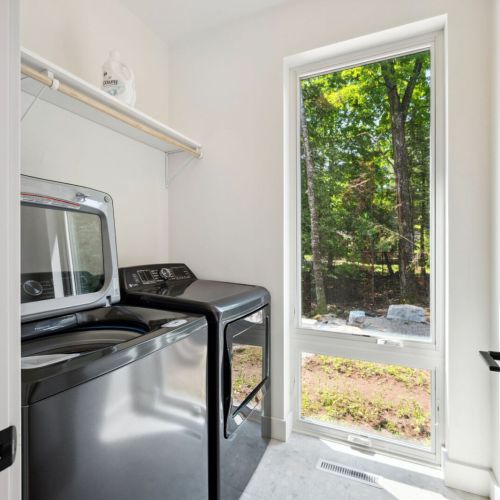 Travel light and stay fresh with in-unit laundry and natural light pouring in through oversized windows.