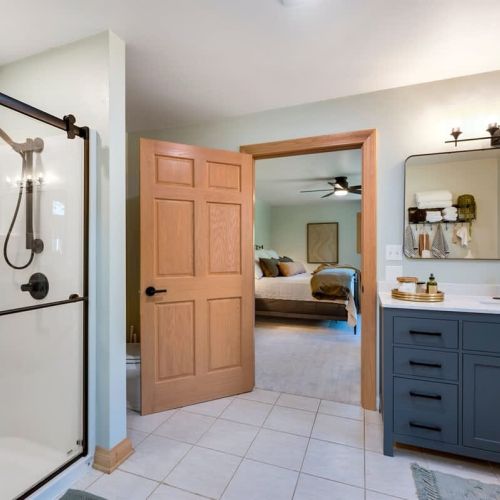 Experience the epitome of luxury and convenience as you pamper yourself in the exquisite ensuite bathroom complete with double sinks and a glass walk-in shower.