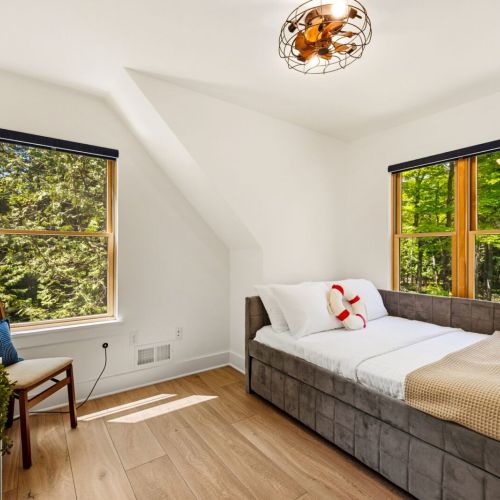 The second bedroom includes a queen bed with a trundle, TV, and DVD player-perfect for kids or additional guests.