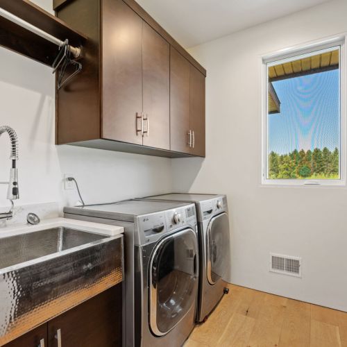 Laundry room with soaking sink.