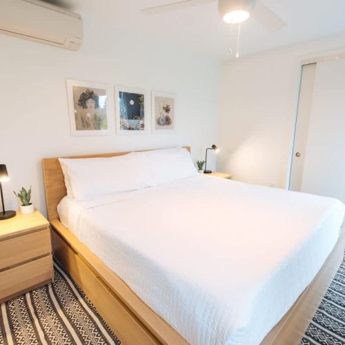 There is 1 bedroom with a king sized bed like the one pictured.  We use high end linens from Comphy Linens.