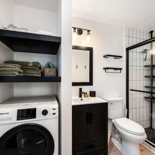 The full bathroom is equipped with all the essentials to make your stay comfortable, and the cabin also offers a washer and dryer for your convenience.