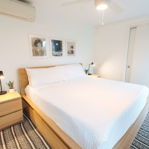 There are a total of 2 bedrooms with king sized beds like the one pictured (1 bedroom in each Flat).