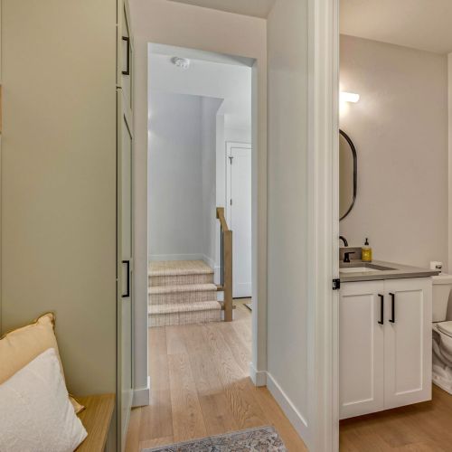 A convenient half-bath on the first floor provides easy access for guests while entertaining.