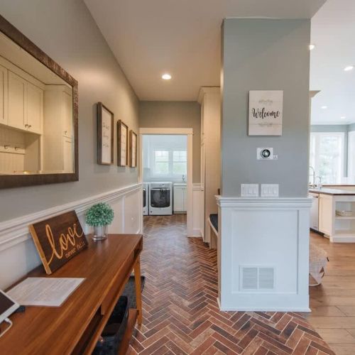 Convenient Laundry Setup: Located off the main entrance, the laundry room is designed for ease and efficiency. It's positioned near the kitchen and dining area, making it accessible yet discreet. With modern appliances and storage solutions, this lau