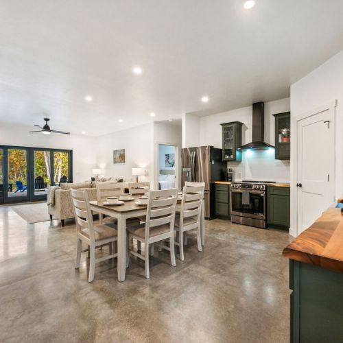 Enjoy a seamless flow from the dining area to the living space in this open-concept design. Open the patio doors to extend your entertaining area outdoors, perfect for hosting the entire family.