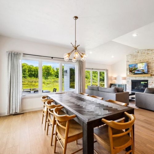 The main living area features a bright and airy open-concept design-a space that invites connection whether you’re cooking, lounging, or gathering for meals.