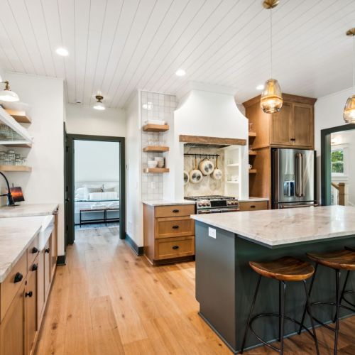 This open-concept space is perfect for entertaining, allowing guests to relax, prepare meals, and stay connected with the company around them.