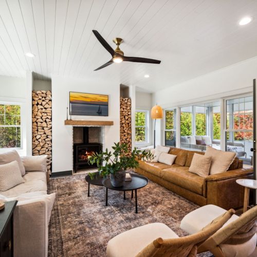 The living area invites you to relax in front of the gas hearth fireplace, with high-speed WiFi and Smart TVs available throughout the home for your entertainment.