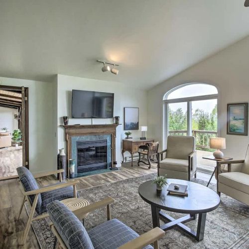 The second living area off of dining room offers abundant space for the entire group to unwind comfortably. You can also relish the warmth of a second fireplace and step out onto the wrap-around deck for even more relaxation and enjoyment.