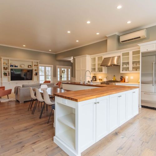 Gourmet Kitchen & Dining Experience: Our kitchen is a chef's delight, equipped with high-end Jenn-Air appliances that cater to all your culinary needs. The spacious layout features ample white cabinetry for storage, sleek countertops for meal prep, p