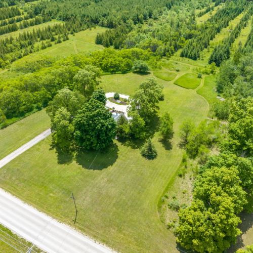 Explore the expansive grounds at Serenity Acres, complete with a fun disc golf course and beautiful walking trails. Enjoy the stunning natural surroundings and wide-open spaces perfect for outdoor activities.