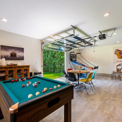 Our detached, lakeside garage houses our game room.