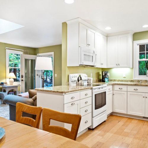 Inside, enjoy the warmth of a cozy fireplace, a well-stocked kitchen for cooking your favorite meals, and a relaxing living space perfect for reconnecting