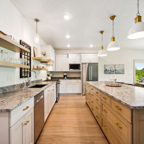 The large eat-in kitchen has all the essentials for preparing meals and snacks, and its open design makes it easy to keep the conversation going.