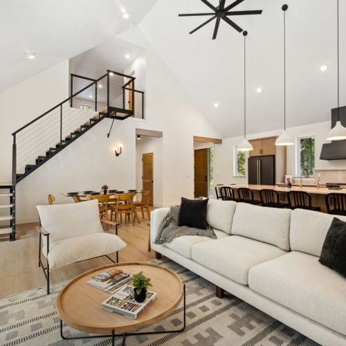 From movie nights to dinner parties, this space brings everyone together under soaring ceilings and chic modern lighting.