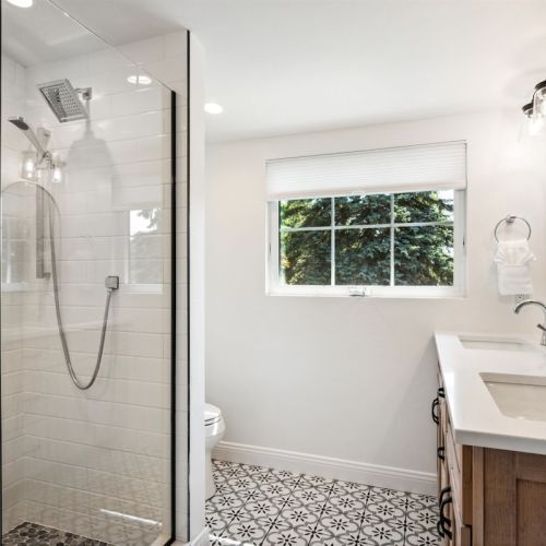 The second floor King suite has an ensuite bath with a dual vanity and walk-in tiled shower.