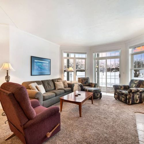 Relax in cozy comfort with an indoor fireplace and sleeper sofa for additional guests. Enjoy views of the grounds and outdoor seating on your own private deck/patio.