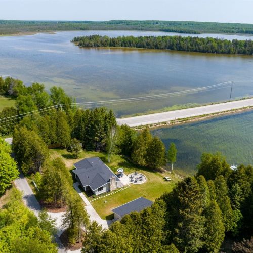 Our home borders the historic Kangaroo Lake causeway, a beloved area in Door County.