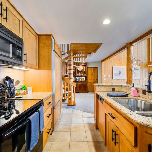 Featuring a sleek electric range and stove, this kitchen is prepped and ready for your culinary adventures. Luxury meets convenience with the state-of-the-art Sub-Zero built-in fridge/freezer, ensuring your ingredients stay fresh in style.