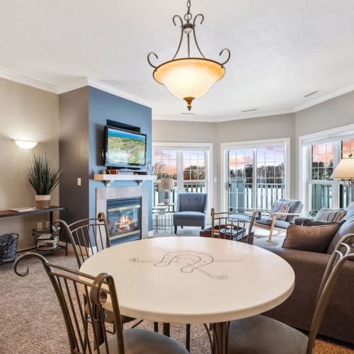 Club Cottage #2 boasts a king bedroom and two twin beds in the second bedroom with en suite bathrooms, and queen-sized pull out couch for additional guests. Enjoy amenities such as indoor fireplace, jacuzzi tub, in-unit washer and dryer and a well-st