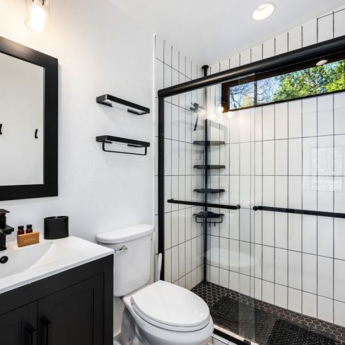 The full bathroom is equipped with all the essentials to make your stay comfortable, and the cabin also offers a washer and dryer for your convenience.