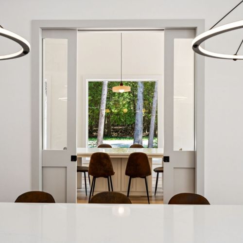 Off the main living area, you'll find a separate gathering area perfect for board games and reading. Sliding glass doors provide additional privacy.