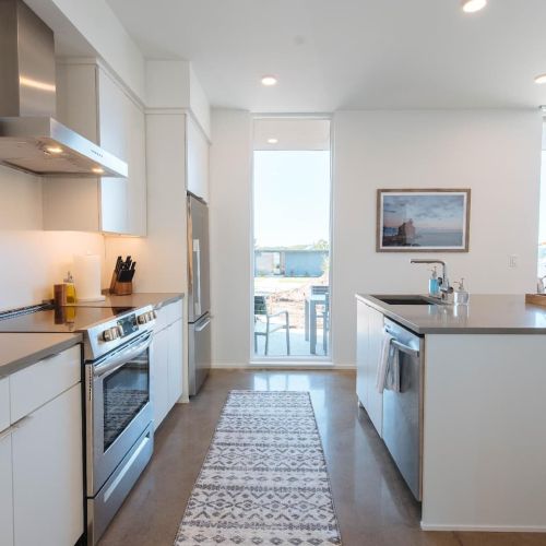 Each kitchen is equipped with everything you need to prepare a meal for your group, with quartz counter tops and breakfast bar seating for 6.