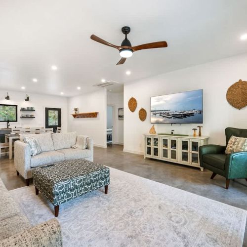 e open-concept living space is perfect for gathering after a day of exploring. With high-end finishes, comfortable seating, and large windows that frame the surrounding woods, this space invites you to unwind. Whether you're watching your favorite sh