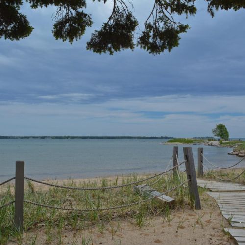 There is a public, sand beach just a five minute walk from your front door!