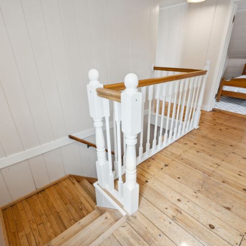 Upstairs, you'll find an additional two bedrooms and full-bathroom.