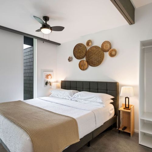 A plush king bed, organic textures, and peaceful views set the stage for truly restful nights.