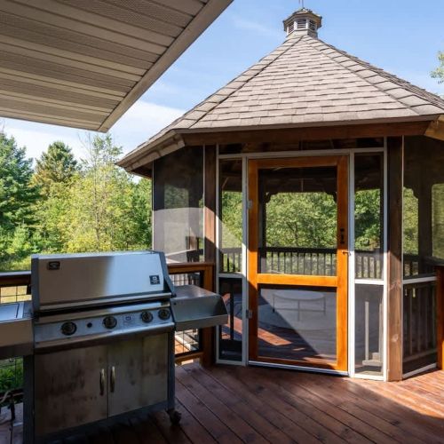 Prep dinner on the propane grill while enjoying a beverage.