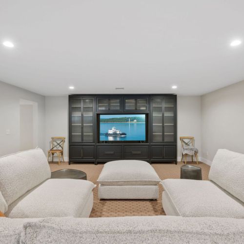 Grab the popcorn and enjoy epic movie nights with family and friends in this cozy, dedicated entertainment space.