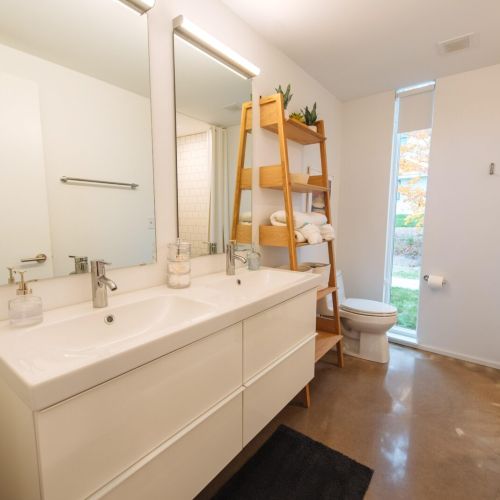 There are a total of 2 bathrooms.  Each bathroom features a double vanity and tile shower.