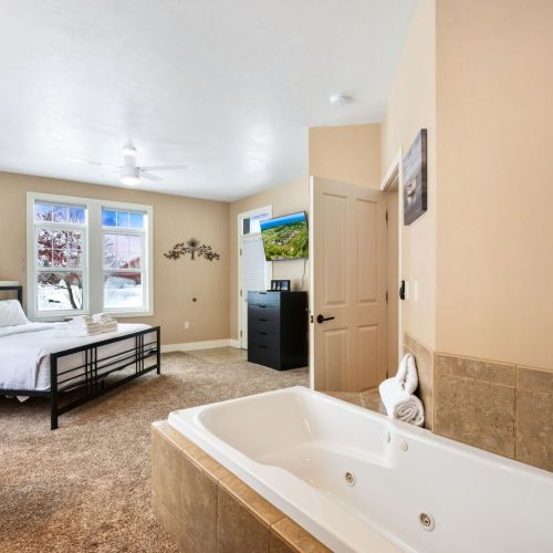 Bedroom #1 boasts a comfortable king sized and large whirlpool tub with en suite bathroom.