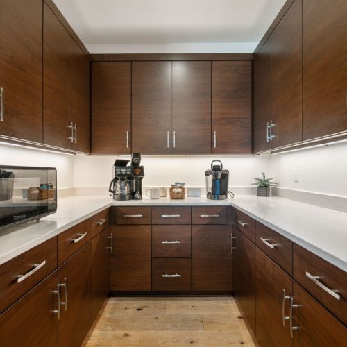 Coffee bar complete with drip-coffee maker and Keurig single-cup coffee maker.