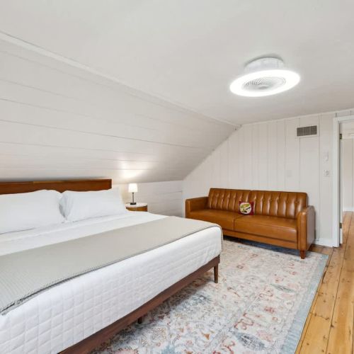 The third and final bedroom, located on the second floor of the home also features a comfortable king-sized bed and smart tv for streaming and relaxation.