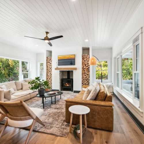 The living area invites you to relax in front of the gas hearth fireplace, with high-speed WiFi and Smart TVs available throughout the home for your entertainment.